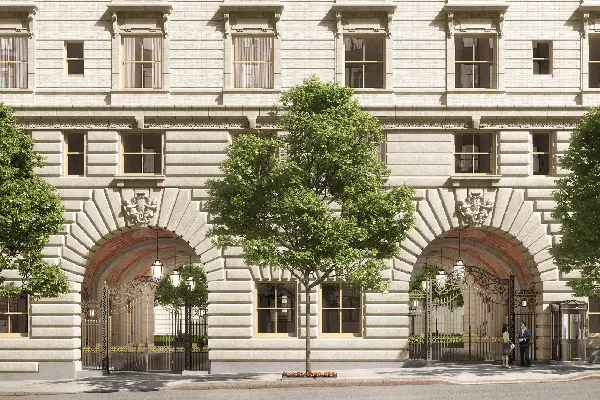 Front facade of the Arconia apartment building with arched entrances and ornate stonework.